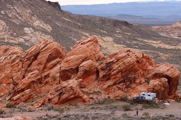 #037 - Chris and Jane BairdBitter Springs Trail, Valley of Fire, Nevada2014 Ford F2502013 FWC GrandbyCamera Used - iPhoneBitter Springs Trail is a BLM backcountry byway forty miles outside of Las Vegas, just west of Valley of Fire State Park.  We have been through this trail in the Jeep, and found bountiful vistas and a number of places to dry camp.  We wanted to return when we could spend the night in the Grandby.  Since this area is still in the desert, camping would have to wait until the cooler months.  The weather cooperated in February.  We loaded up the truck, made our way down the rocky trail and found this great out-cropping of red rocks.  It had a natural fire alcove, so we settled in for the weekend.  We were hoping for clear starry filled skies but the clouds rolled in.  It was still a great time.  It was less than two hours from Vegas, but it seemed like a whole new world.  You gotta love truck camping!
