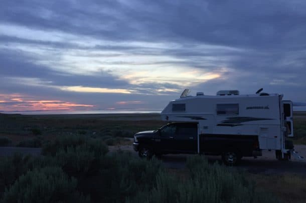 #028 - Doug JensenBridger Bay Campground, Antelope Island State Park, Utah2017 Ram 35002017 Northern Lite 10-2 EX CDSECamera Used - iPhone 6This photo was taken in June 2017 on the first road trip with my new truck and camper.  I went to Bridger Bay campground located on Antelope Island in the Great Salt Lake.  The sun was setting after I had walked back to camp following a soothing, floating soak in the lake.  The campground is primitive, and I felt right at home.  I didn't need any hookups to enjoy testing the outside shower with hot and cold running water to rinse.  I was certainly one happy camper!