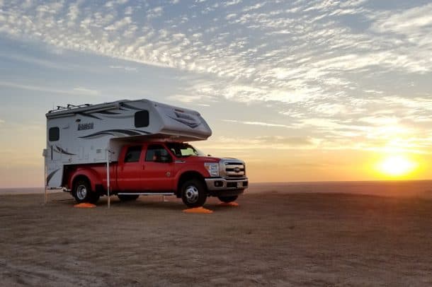 #156 - Daryl HartleyBuffalo Gap National Grasslands, South Dakota2016 Ford F3502017 Lance 975Camera Used - Samsung Galaxy S8We were on a weekend restaurant tour.  We started in Lincoln, Nebraska and spent the first night in Thedford, Nebraska at a city park with free water and electricity.  While in Thedford I posted my weekend plans on social media, indicating we were going to camp the next night in Badlands National Park at a boondocking campground.  A camper from Pennsylvania told me he was there a couple of weeks ago, but stayed just outside the park on the northwest side on a cliff that overlooked the Badlands.  He stayed with a couple other campers for free.The next day we ate lunch in Rapid City at Firehouse Brewing Company and then drove to the Badlands to set up camp.  I missed my intended turn, but could still get to the campground through the main entrance, however it was going to cost $20 or $25 to enter the park.  My intentions for the trip were free camping since we were spending big money on food. However, about half a mile north of the park entrance, I noticed several campers parked up on a ridge about a quarter mile east of the highway, which was the location the guy from Pennsylvania told me about.  We turned around, drove to the site, and set up camp for the second night on the ridge overlooking the Badlands, which is where the picture was taken.We had bighorn sheep come right up to the camper and then bed down for the night on the ridge just below us . The picture is the sunrise over the Badlands the following morning.  We left later that morning, drove to Devils Tower Wyoming, and then onto Hartville, Wyoming to eat at Miners and Stockmen's Steakhouse and Spirits.  We spent the third night just south of Hartville at Grayrocks Reservoir where we once again boondocked for the night.  The next day we drove back to Lincoln.  The total mileage for the trip (to visit two restaurants) was 1563 miles.