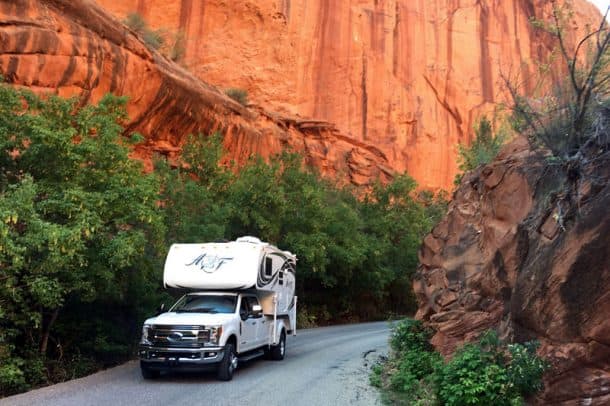 #174 - Sam and Lisa PoundsBurr Trail Road, Boulder, Utah2017 Ford F3502018 Arctic Fox 990Camera Used - Nikon D7200This was a last minute camping trip after reading about this trip in a story on Truck Camper Magazine.We loaded up the 990 threw in the fur kids (Missy and Bella) and headed out to Boulder, Utah.  It ended up being a nine-hour drive, but we found a nice secluded camp spot, fed and watered the kids, fired up the Weber and had a nice dinner of grilled salmon and asparagus with a cold bottle of wine.  The next morning we had a leisurely breakfast, packed up and headed towards Bullfrog stopping along the way snapping pictures and admiring the beauty around us.  This shot was done to show the enormity of the red walls we were surrounded by.