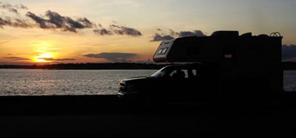 Sunset beach with a Northstar truck camper