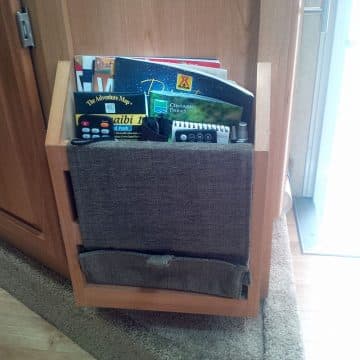 Camper magazine rack with other supplies