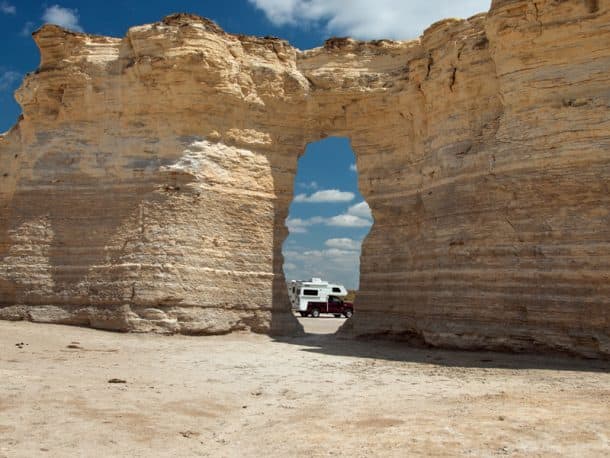 #280 - Larry RouttMonument Rocks, Kansas2005 Ford F-3502004 Lance 820Camera Used - Nikon 5000In the 13 years we have had our truck camper we have crossed the country several times, and always avoided going through Kansas.  This year we decided to fill in the blank spot on our map, gritted our teeth and went into the Kansas prairie.  Boy, were we surprised!We enjoyed the Tall Grass National Preserve, Mushroom Rock State Park (the state's smallest park at only five acres) and finally, the coup de grace, Monument Rocks in west central Kansas.  The monuments and arches are on private property, but the owners allow access to the area.  There are even signs pointing the way.  It is otherworldly to drive through the prairie and then come upon this scene.  When I show the pictures to others, the response is always an incredulous, 