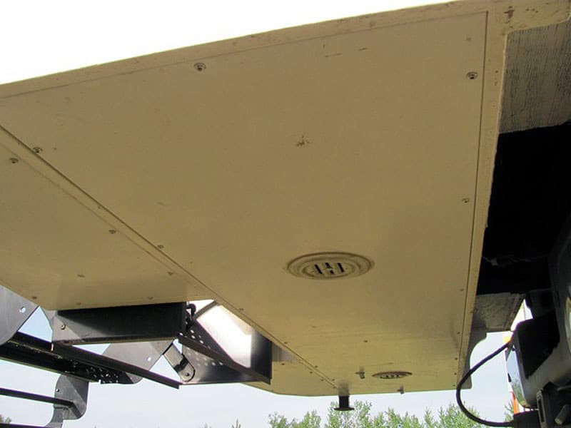 Under overhang, grey tank storage