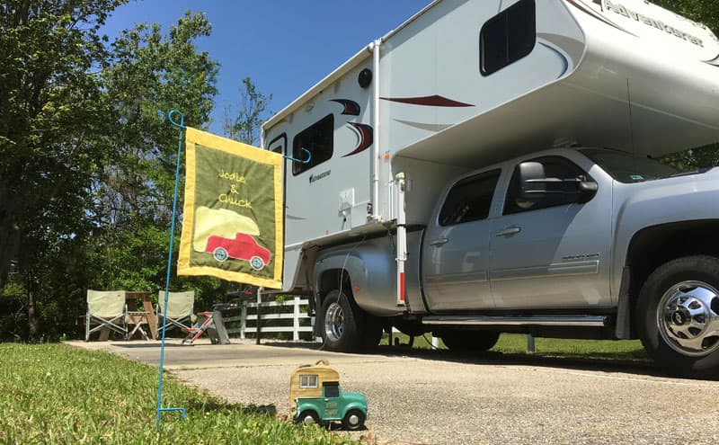 Campsite With Truck Camper Sign Adventurer 116DS