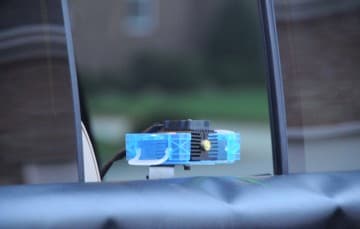 Close-up-of-Laser-attached-to-slide-truck-rear-window