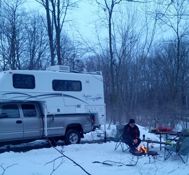 Bigfoot camper campfire winter