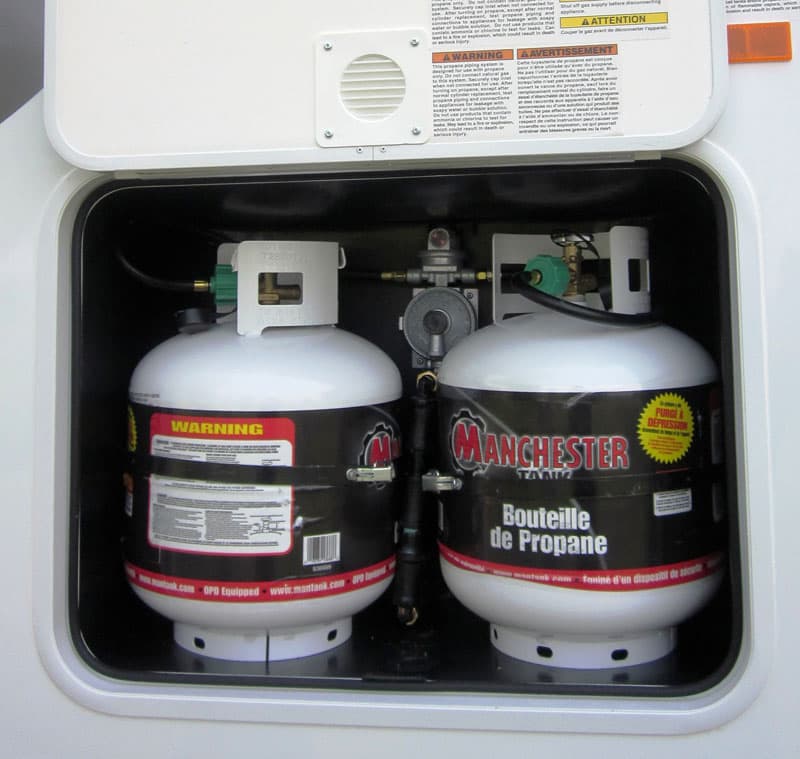 Eagle Cap 811 two vertical 20-pound propane tanks