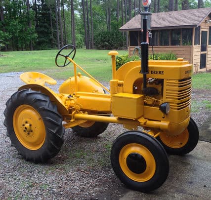 antique-tractors-chainsaws-yellow-tractor