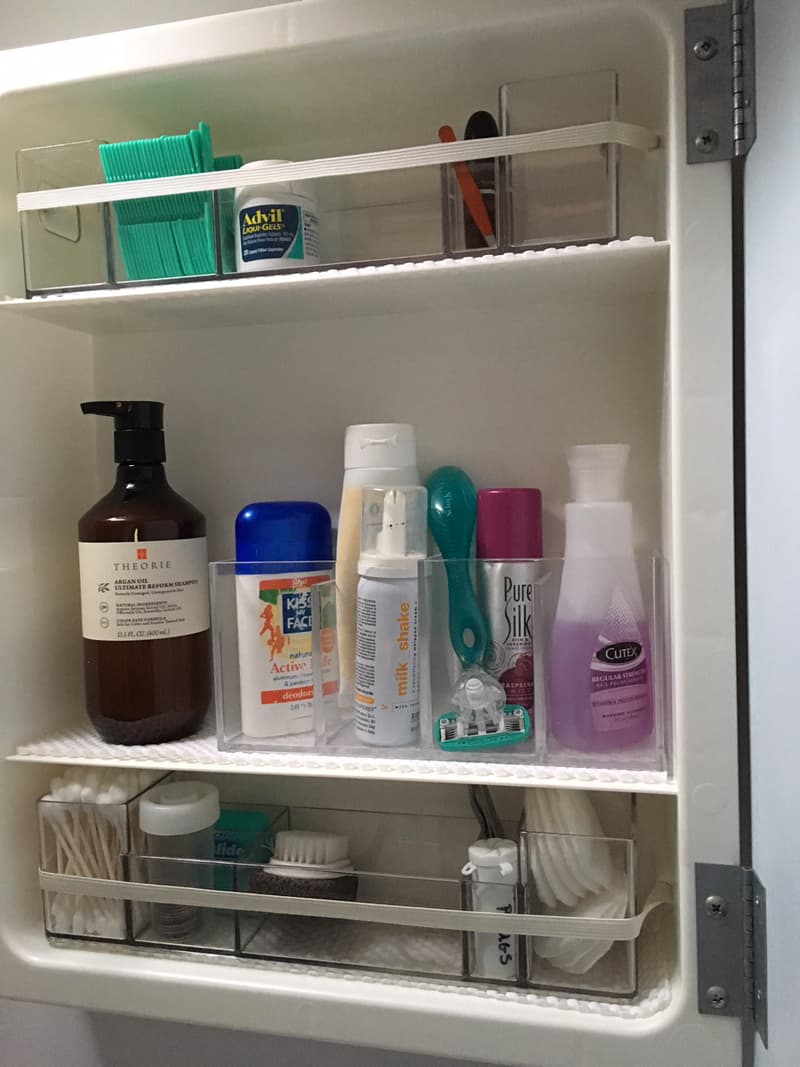 Bathroom organization in mirrored cabinet