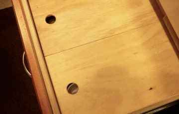 False bottom drawer covered