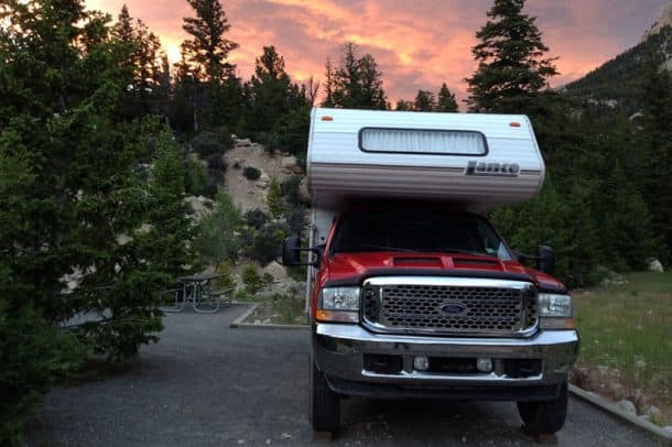 #070 - Tim and Connie MurninFive Springs Falls Campground, Wyoming2002 Ford F2502002 Lance Lite 815Camera Used - iPhoneWe had just come down over the Bighorn Mountains and were looking for a place to camp.  We saw a sign for camping just three miles off the road.  Little did we know that we would be driving switchbacks back up the side of a mountain!  Luckily we didn't meet anyone coming down.Once we got to the upper campground, we realized that the ride back up the mountain was well worth it.  The view at Five Springs Falls campground went on as far as the eye could see and the sunsets were beautiful!  There was no one else there.  We've been back a couple times since then, and were able to finally snap the picture as we were treated to the sunset.