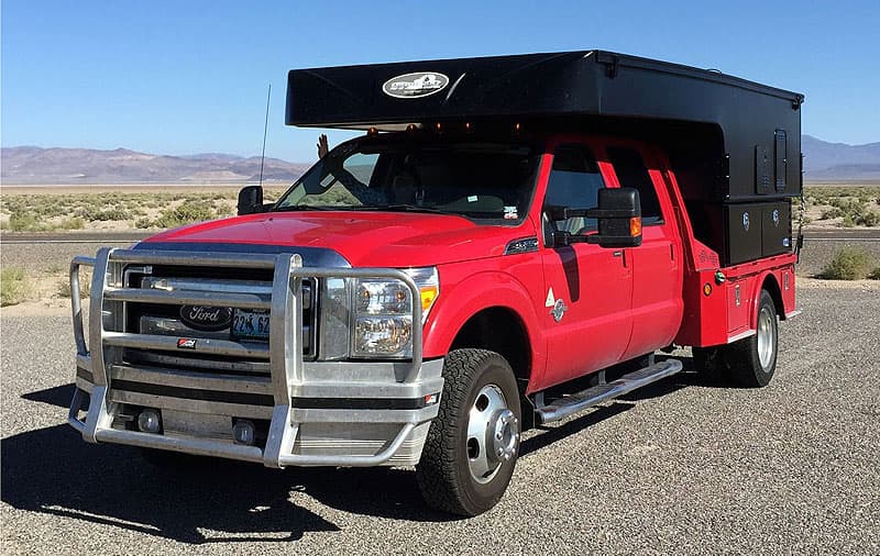 Ford F350 flatbed with Phoenix Camper