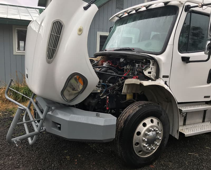 the bumper brush guard folds down and the hood totally exposes the engine