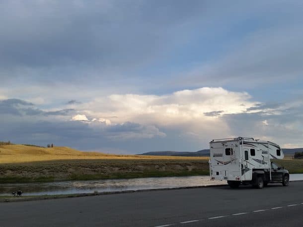 #260 - Joan ThompsonHayden Valley, Yellowstone National Park, Wyoming2011 GMC Sierra HD 35002013 Lance 1191Camera Used - Samsung S5 phoneMy husband and I have a love/hate relationship with Yellowstone. Having worked there years ago in both summer and winter seasons, we have been fortunate to know it in quieter times, and it holds many memories.  Yet when we return from time to time, we usually come away disappointed, hating the crowds that seem to be everywhere, even in the off-seasons.  We love the park, but we hate the crowds. This summer, after enjoying the eclipse in central Idaho, we realized that our most direct route home was to drive through Yellowstone.  We decided to compensate for the crowds by seeking out solitary places at dawn and sunset.  This shot was taken in Hayden Valley one evening.  There was a grizzly jam at the north end of the valley, and we drove right on past.  We've seen grizzlies in Hayden Valley before.  We were looking instead for a quiet spot to take our chairs down to the river and watch the sunset.  We found it here.  The chairs (and my husband) are visible in the lower left corner.