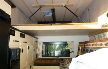 Four Wheel Camper king size bed 