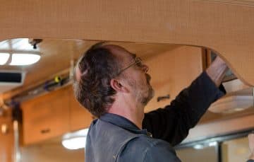 John Sawvel, working on camper interior cabinets