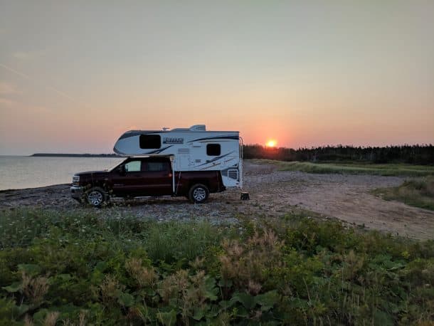 #309 - Dennis and Jeanne TrubyBayfield, Nova Scotia2016 Chevrolet 3500HD2014 Lance 825Camera Used - PixelOn our two week trip to Nova Scotia and PEI we were always looking for interesting places to spend the night.  We drove to the Bayfield Pier and thought we would spend the night there.  We went for a short drive after dinner and saw an unmarked two track heading north.We are always up for an adventure, so took the road and after about 1/4 mile the road opened up on a rocky beach with an amazing view of the Northumberland Strait.  What a treat to watch the sunset on one end of the beach and sunrise on the other!  We were up early to see the sun peak out.   There is nothing like a truck camper for exploring and finding out of the way places to camp.  It was one of our favorite nights on the trip.