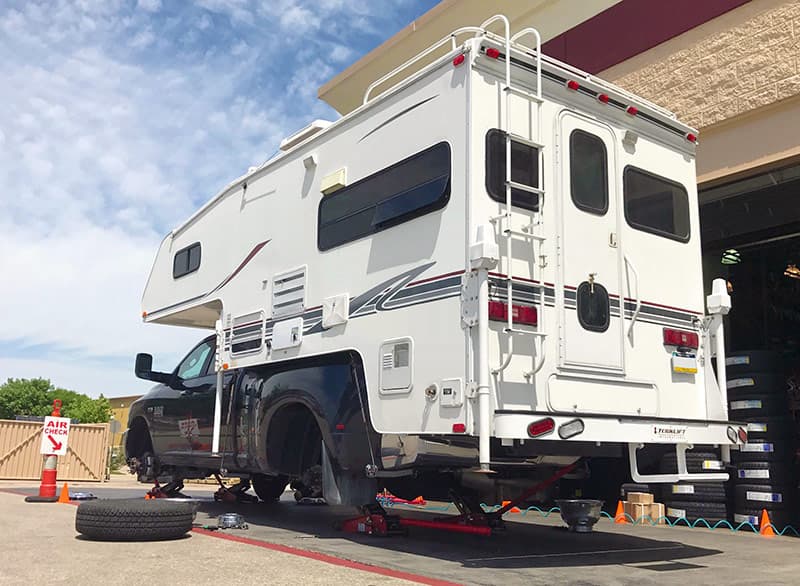 Truck camper levitating above the ground