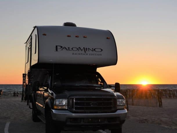 #301 - Mark and Debbie CaseLudington State Park, Michigan2004 Ford F3502017 Palomino HS-2910Camera Used - Nikon D5200Pictured is our 2017 Palomino 2910 hard side camper on our 2004 Ford 350.  The landmark in the background is the Michigan Ludington State Park Beach house.  It was built in 1935 by the Civilian Conservation Corps.Ludington State Part is one of the places that needs to be on every camper’s go see list.  It is located along the west coast of the northern lower peninsula.  The park has approximately 5,300 acres and miles of sandy shore line.  On a clear day the view is endless for the Big Sable Point Lighthouse which is also located within park.We were introduced to the park by friends 12 years ago and have continued to return each year.  We have always found new adventures and the park has never lost its appeal.  With hiking trails, sand dunes fishing and endless shoreline there is always something to enjoy.