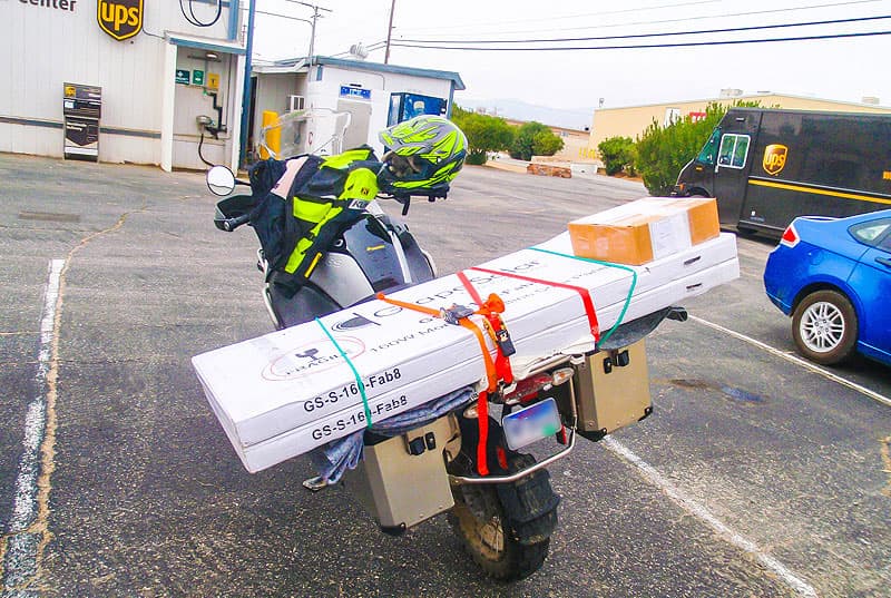 Mail-on-motorcycle-solar-panel-delivery