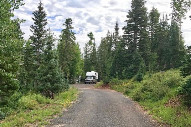 #165 - Jack RiordanNavajo Lake, Utah2006 GMC 2500HD2006 Six-Pac D850Camera Used - iPhone7+After three days in Zion National Park with temperatures soaring well over 100 degrees, we raised our legs and headed north on I-15 seeking a cooler climate.  Having lived in Southern Utah for a few years, we knew that there was no shortage of boondocking options, but had our heart set on Navajo Lake.We arrived in the midst of a hailstorm that had the landscape blanketing in white.  That evolved into an epic thunderstorm for the rest of the night!  Our trusty Six-Pac kept me, my wife, our two kids, our 80-pound golden retriever, and a four week old puppy safe and snug as the thunder rolled on by.