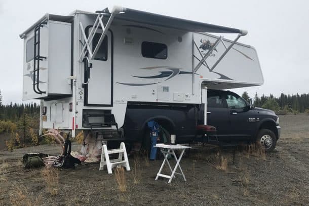#145 - Tom WarrenPaxon Lake, Alaska2013 Ram 35002013 Eagle Cap 1160Camera Used - iPhone 7This was a weekend caribou hunting trip about 250 miles north of Anchorage along the Richardson Highway.  As you can see in the photo this was a successful trip, hunting wise.  The rain was relentless.  We had a constant rain the entire trip.  It was sure nice to have a dry and warm camper to come back to at the end of the day. T his trip was an exploration for us as well since we rarely go up that far north.  Despite the weather this was a great weekend road trip.  What a great place to live...this land called Alaska.