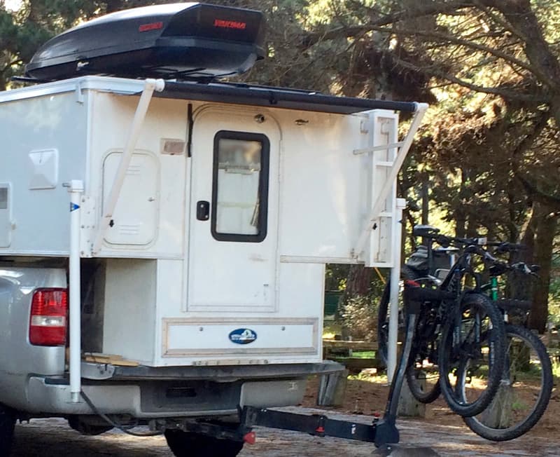 Swing out bike rack and exterior drawer storage