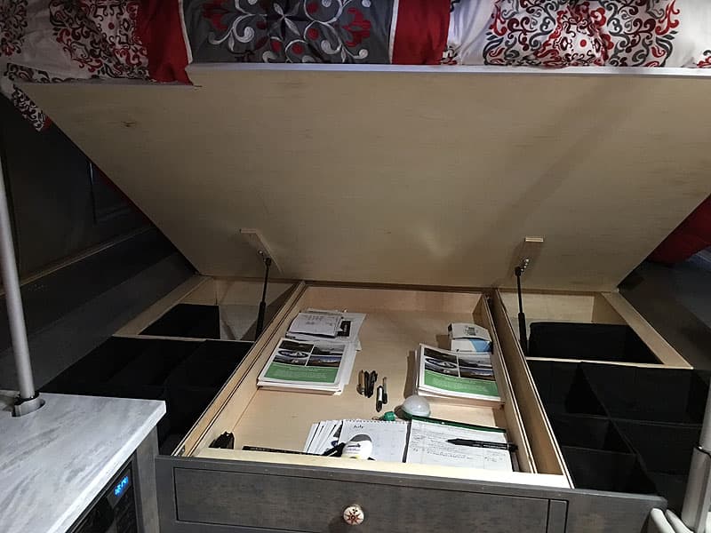 Under bed storage in the Phoenix flatbed camper