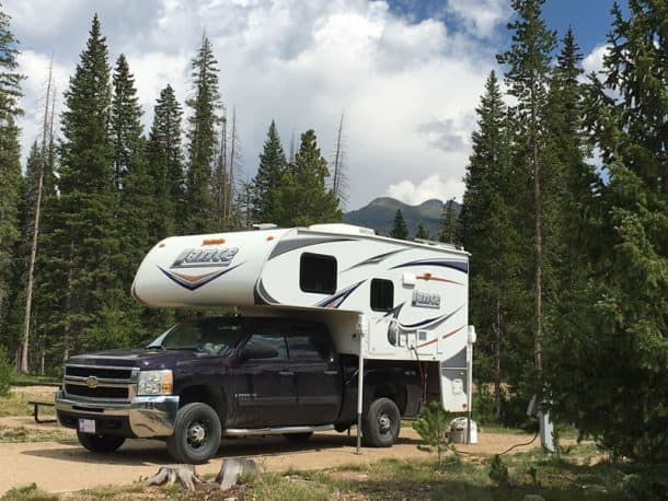 #230 - Mark and Sheryl AndersonRanger Lakes Campground in State Forest State Park, Colorado2008 Chevy 25002012 Lance 855SCamera Used - iPhone 6SWe like to get out of the heat at the end of our Kansas summers and head north or west to cooler climates.  This year we decided to travel through Rocky Mountain National Park and explore State Forest State Park near Walden, Colorado.  This area is known as the Moose Viewing capital since Shiras Moose were introduced in 1978.  We only spotted one moose and it was nearer to Grand Lake, but we were happy to have found this beautiful, well-maintained, quiet campground.  We enjoyed sitting by the campfire surrounded by the mountains and the short hike to a trout-filled mountain lake.