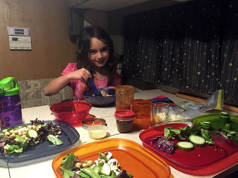 Kids cooking in a truck camper