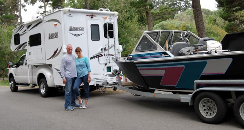 Rosemary and Mark Hellwig with boat and camper