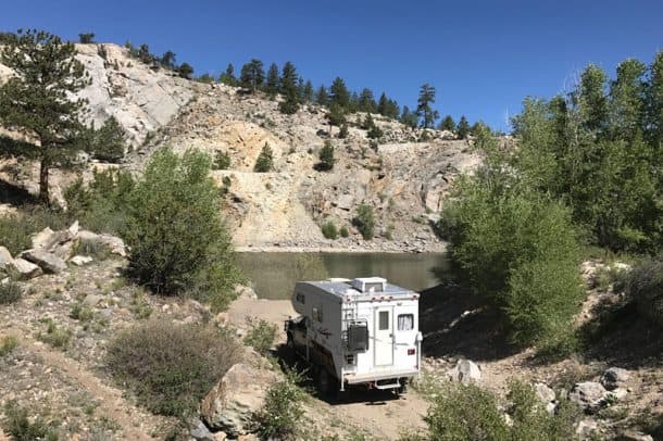 #096 - Erica MoserSalida, Colorado2009 GMC Sierra 3500HD2002 Adventurer 810WSCamera Used - iPhone 7My husband and I were down on the Arkansas River for a weekend of river surfing.  Usually we just drive into the National Forest at night to find a spot to camp.  We headed up earlier than normal, so we decided to drive further than we usually do to try and find a good spot.  We kept taking turns at forks in the road and ended up by ourselves in this beautiful secluded rock quarry.  It's too bad we didn't have our fishing poles.  Our dog enjoyed fishing in the water in our place.