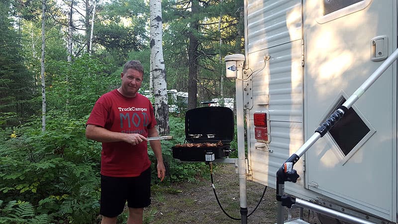 Brian Sibbles using the barbecue