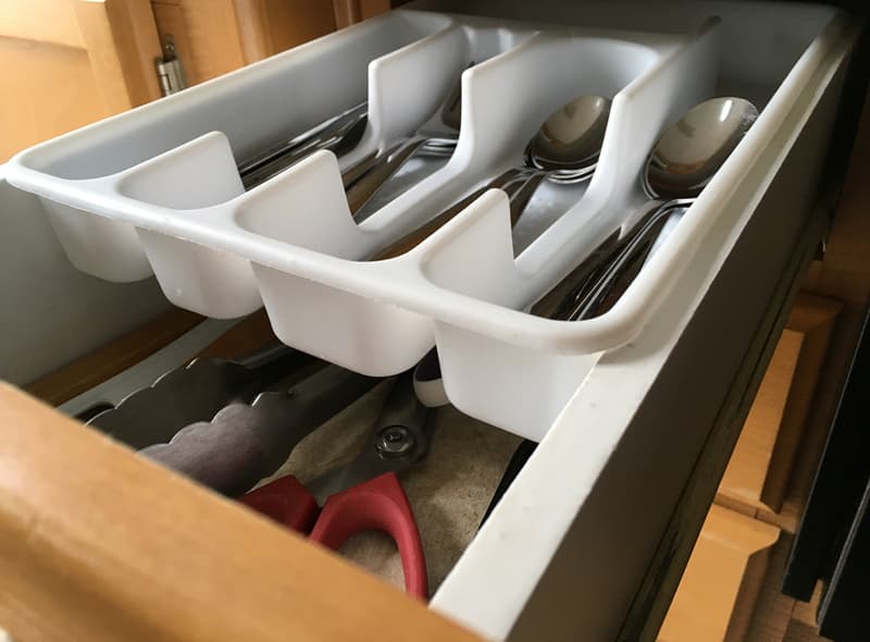 Silverware container on top drawer rails