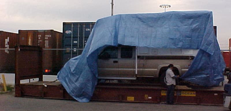 Tarping on flat rack carrier for roll-on roll-off