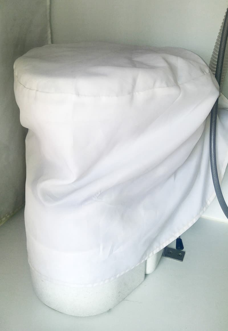 Toilet cover for a truck camper