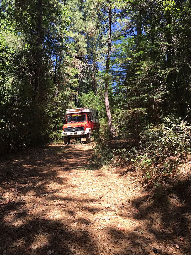 Unimog camper exploring off-road trails