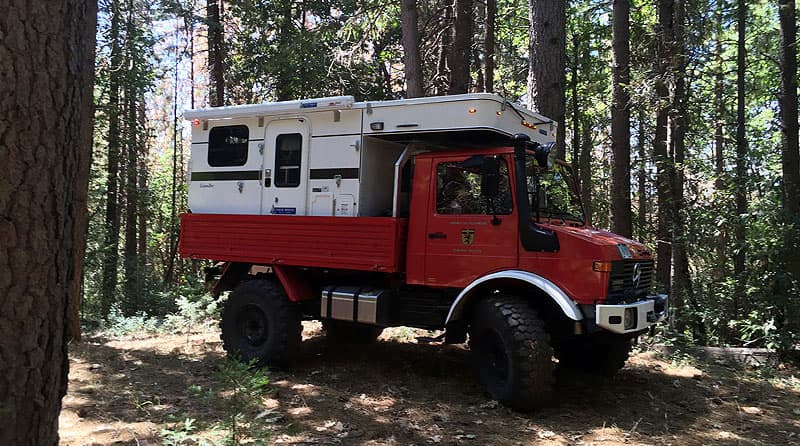 unimog-flatbed-four-wheel-camper-side-view