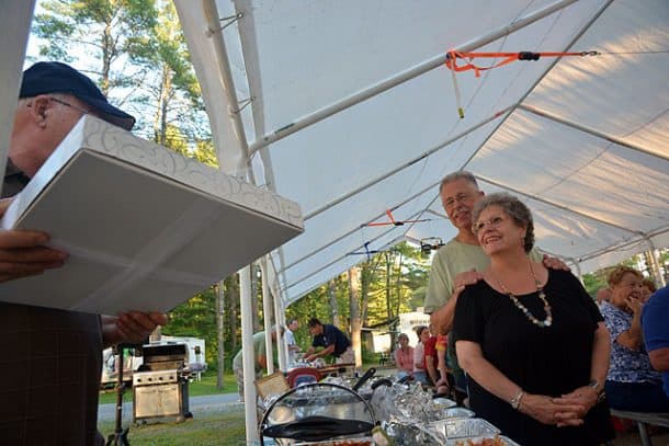 Wagonmasters, Joe and Marianne Zecca, receiving a gift, photo taken by Angela White