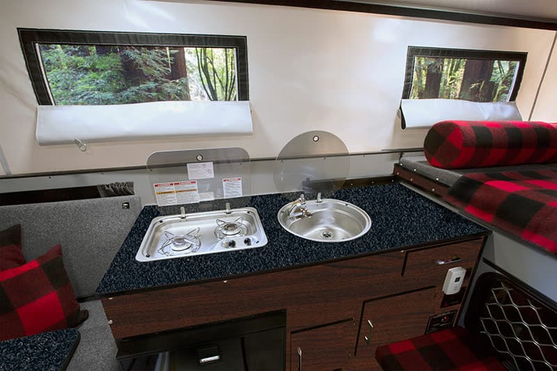 Cocoa Maple wood grain Mica for the base cabinetry, and Blackstone Mica on the countertops