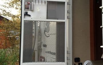 Expanded metal grid for camper door