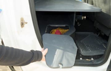 Back seat hidden storage for camera gear