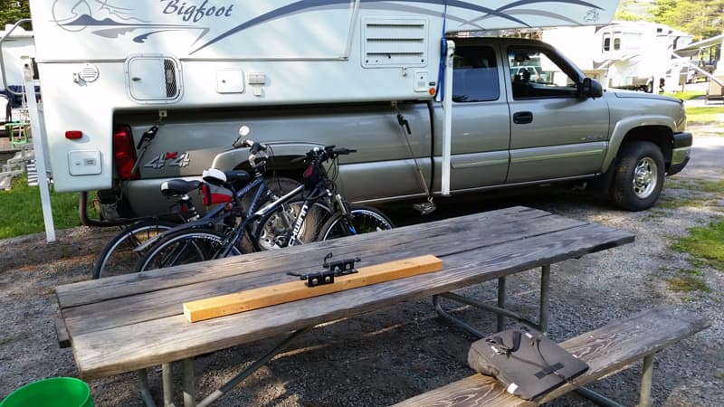 Quick release clamps on board to hold bikes