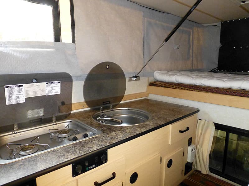 Four Wheel Camper, stove and sink