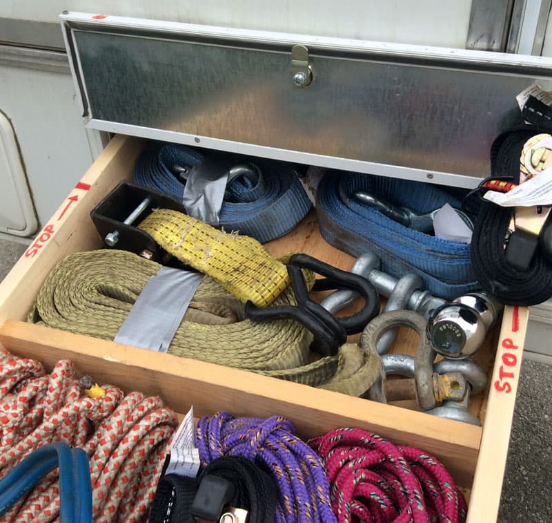 Drawer of recovery straps in a camper