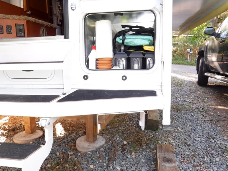 Paper towel holder on exterior camper