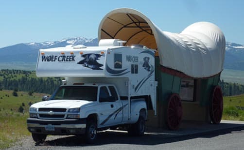 Wolf Creek and covered wagon