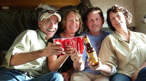 Ray, Cindy, Dennis, and Lori in the Palomino truck camper