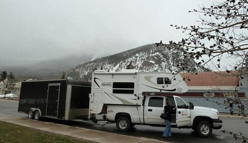 Truck Camper towing Jeep trailer